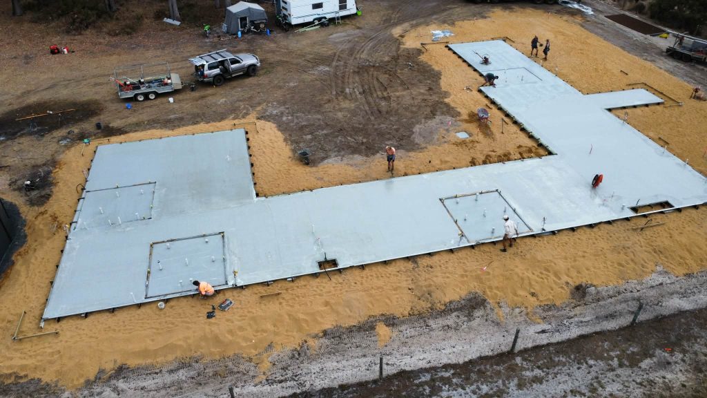 Pouring polished concrete slab with colour in it