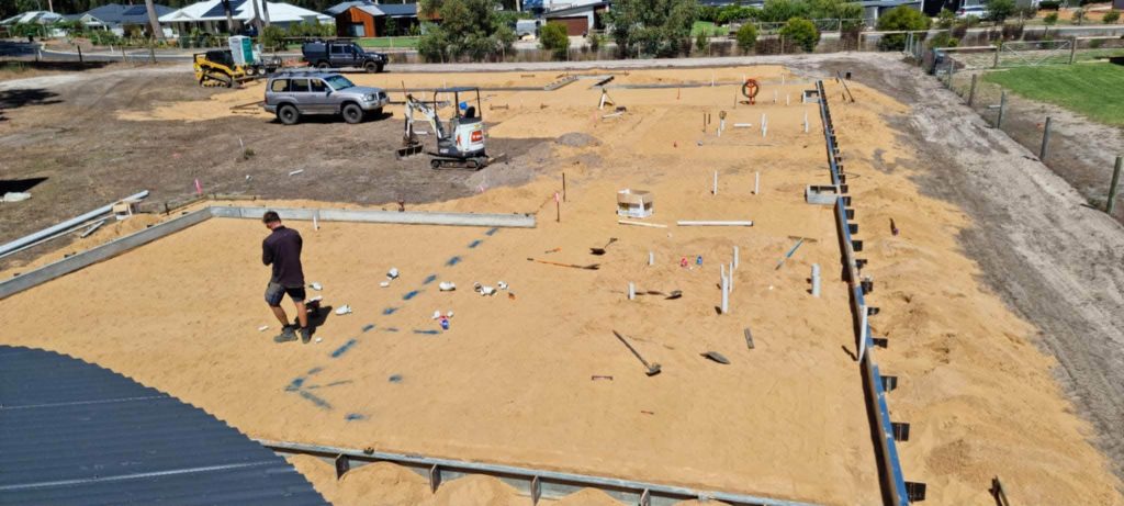 Plumbing and electrical prelay prior to concrete slab pour